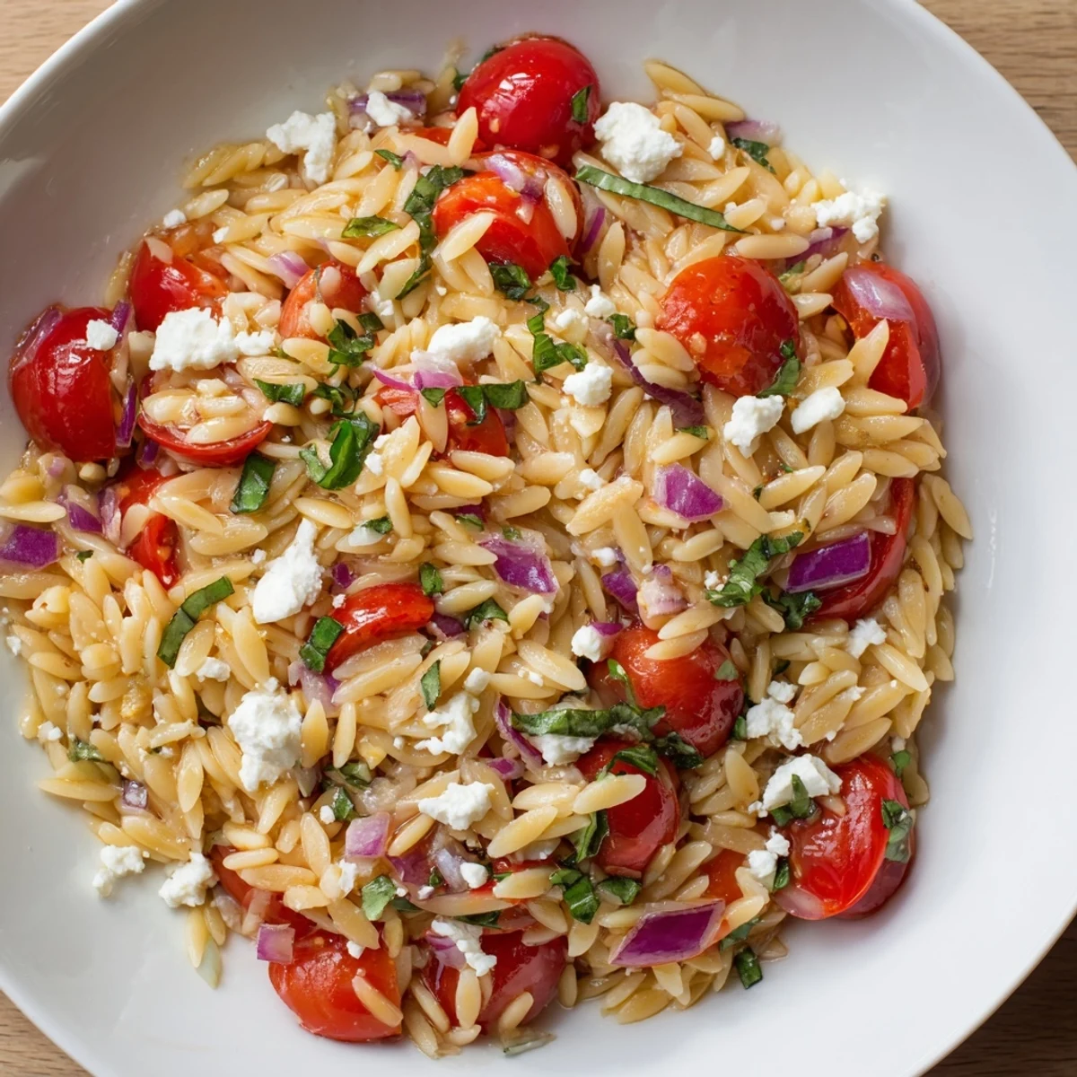 Vibrant Tomato Feta Orzo salad with fresh herbs, a delicious and easy Mediterranean side dish.