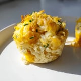 Warm, fluffy German style savoury muffins showcasing cheese and onion, ready to eat alongside soup.