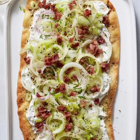 Crispy Sheet-Pan Flammkuchen with bacon and leeks, a savory flatbread, ready to share.