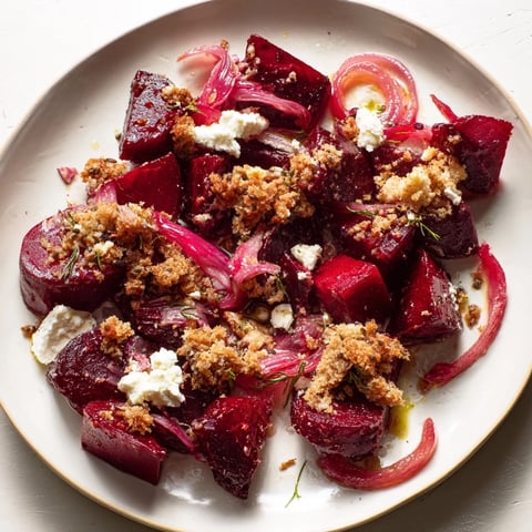 Warm Beet & Caraway Seed Salad with Toasted Rye Breadcrumbs: A colorful plate of roasted beetroot salad with crunchy breadcrumbs.