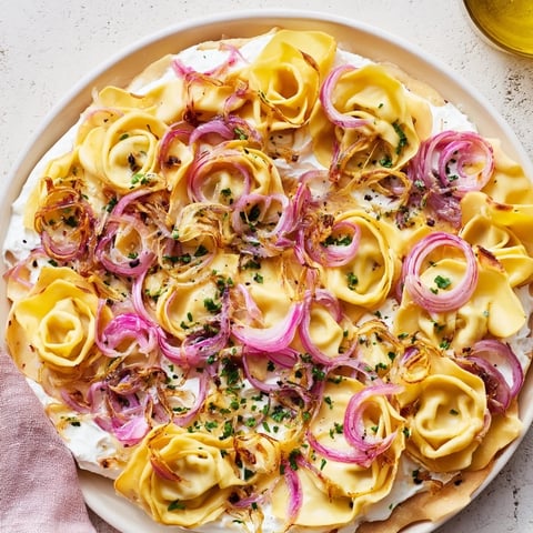 Crispy Savory Maultaschen Flatbread, topped with melted cheese, offers a warm, inviting aroma.