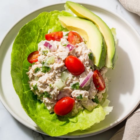 Creamy tuna salad lettuce wraps, filled in fresh lettuce, a healthy and delightful lunchtime choice.