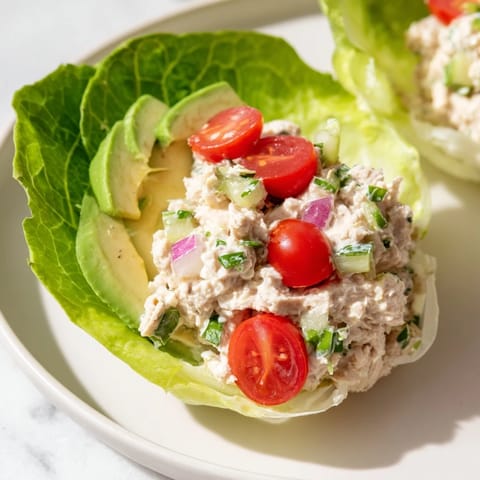 Butter lettuce cups filled with vibrant tuna salad, a quick and easy low-carb recipe option.